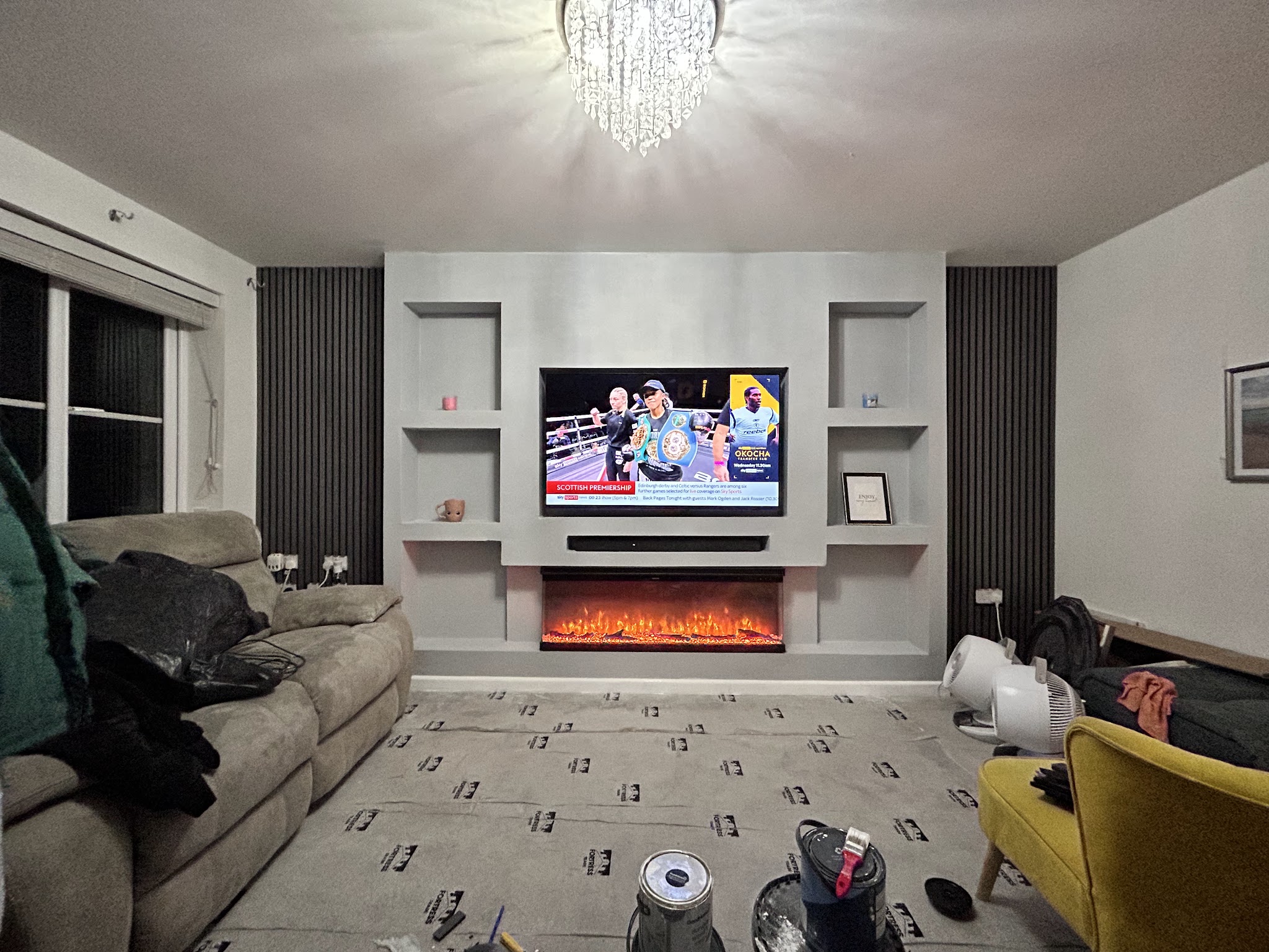 The same room with the recessed television wall and shelving completed