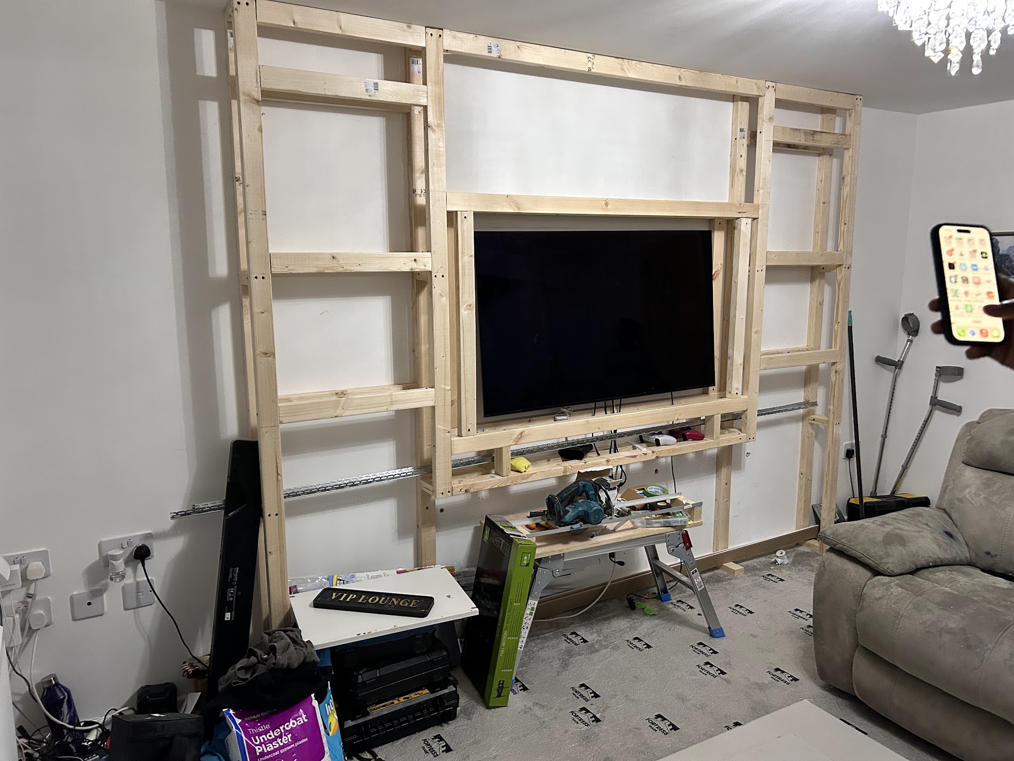 Timber framework around a television during a Jayjay home project