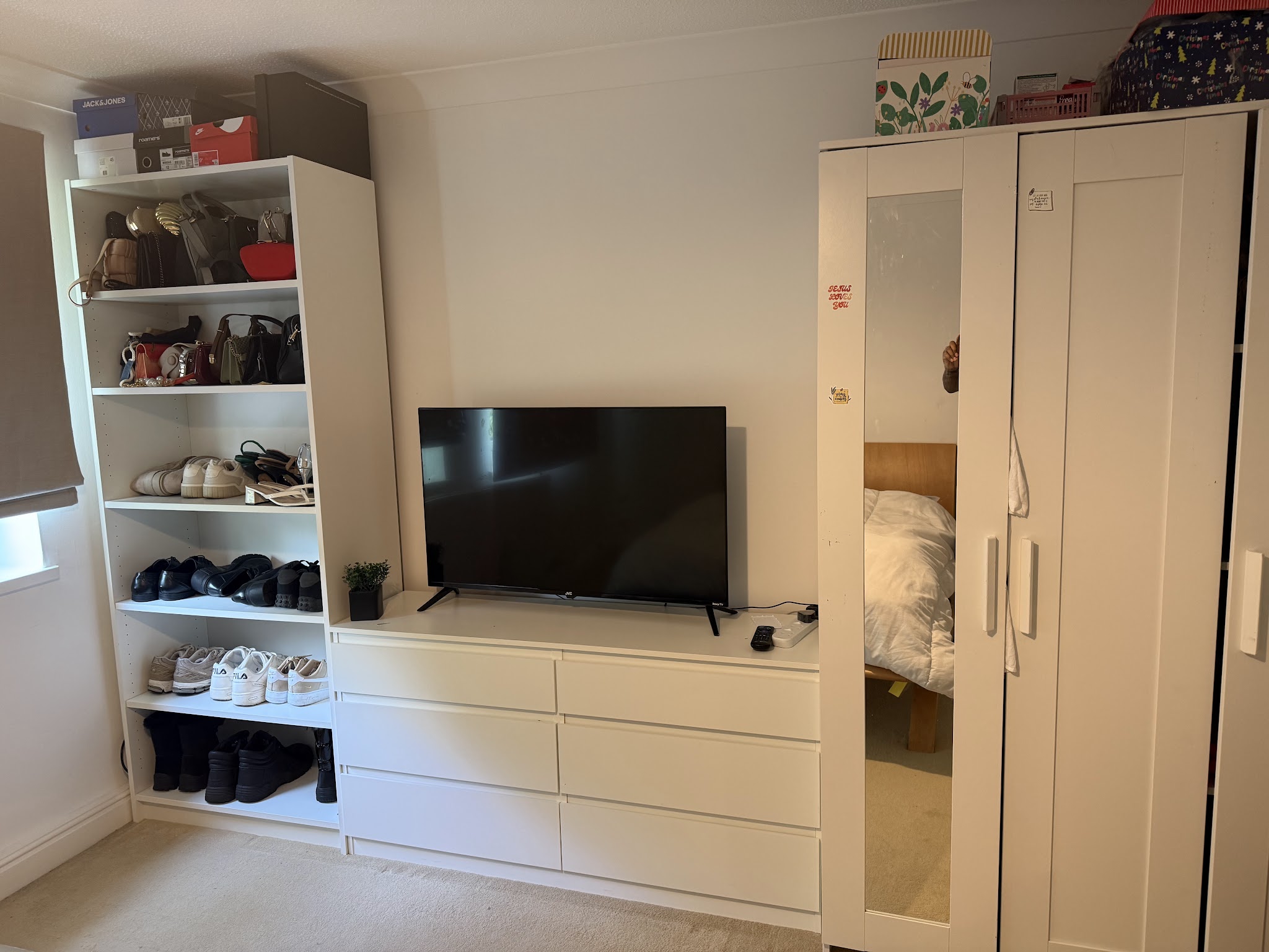 White wardrobe, open shelving and drawers in a customer's bedroom